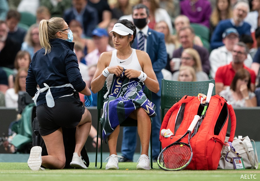 Emma Raducanu receives treatment on court