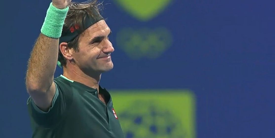 Roger Federer smiles after his first match in over 400 days
